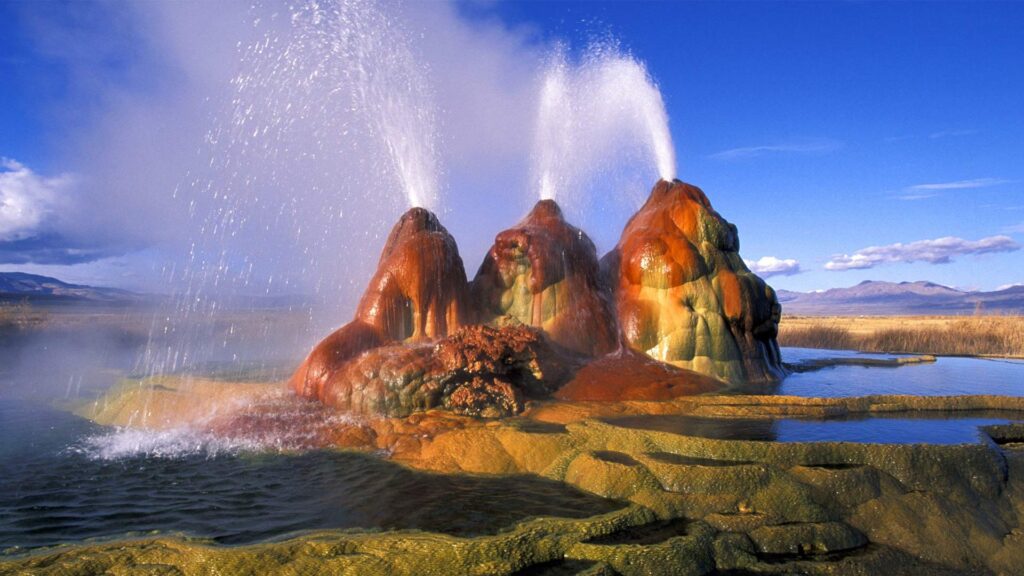 Vibrant, multicolored Fly Geyser spraying water in the Nevada—one of the most otherworldly and hidden US destinations.