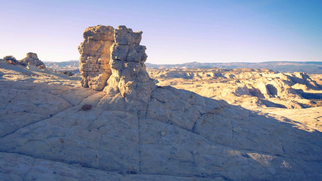 Sunlit rock formations and expansive desert landscapes at The Grand Staircase in Utah — a hidden US destination perfect for off-the-beaten-path adventures and scenic solitude.