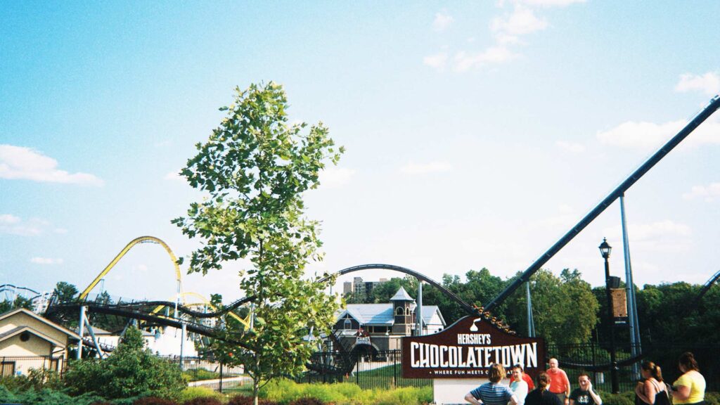 Families gathered at Hershey’s Chocolatetown in Hershey, Pennsylvania—an exciting and budget-friendly destination for affordable family vacations with thrilling rides and sweet experiences.