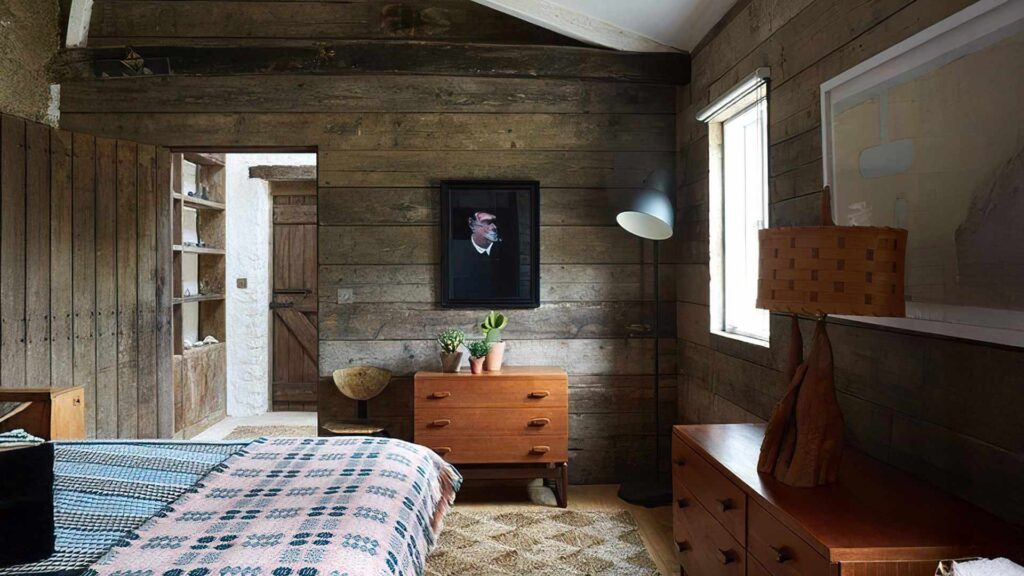 Rustic wooden hotel room with vintage decor, natural lighting, and cozy ambiance in cheap hotels.