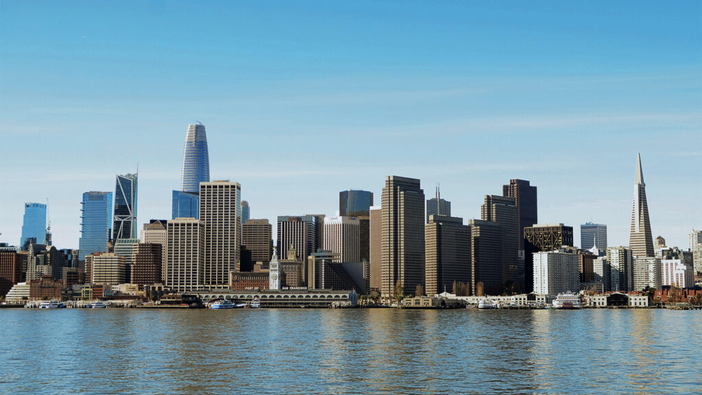 The vibrant skyline of San Francisco with modern skyscrapers and the famous Transamerica Pyramid, a must-see view for visitors seeking hotels in San Francisco.