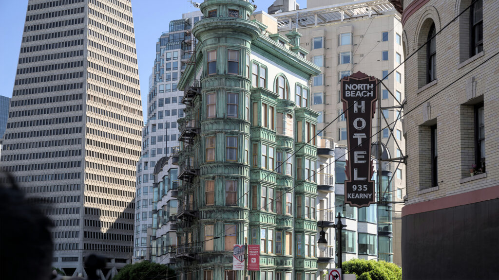 A historic building in San Francisco's North Beach neighborhood, showcasing the vintage charm of hotels in San Francisco, with the North Beach Hotel's sign prominently displayed.