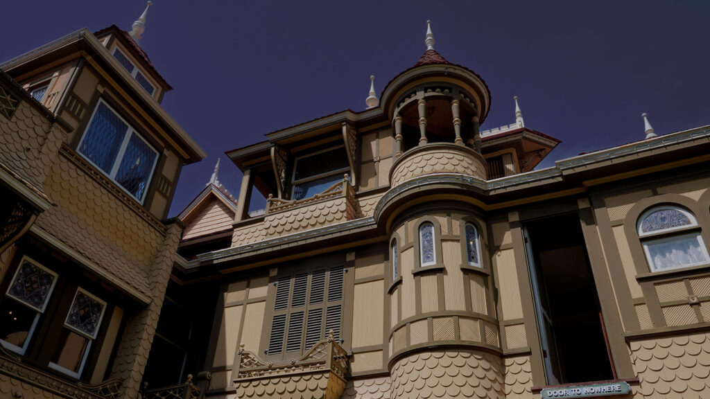 The Winchester Mystery House in San Jose, a peculiar and mysterious house with unconventional architectural features, often linked to ghostly legends, representing one of the haunted places in America.
