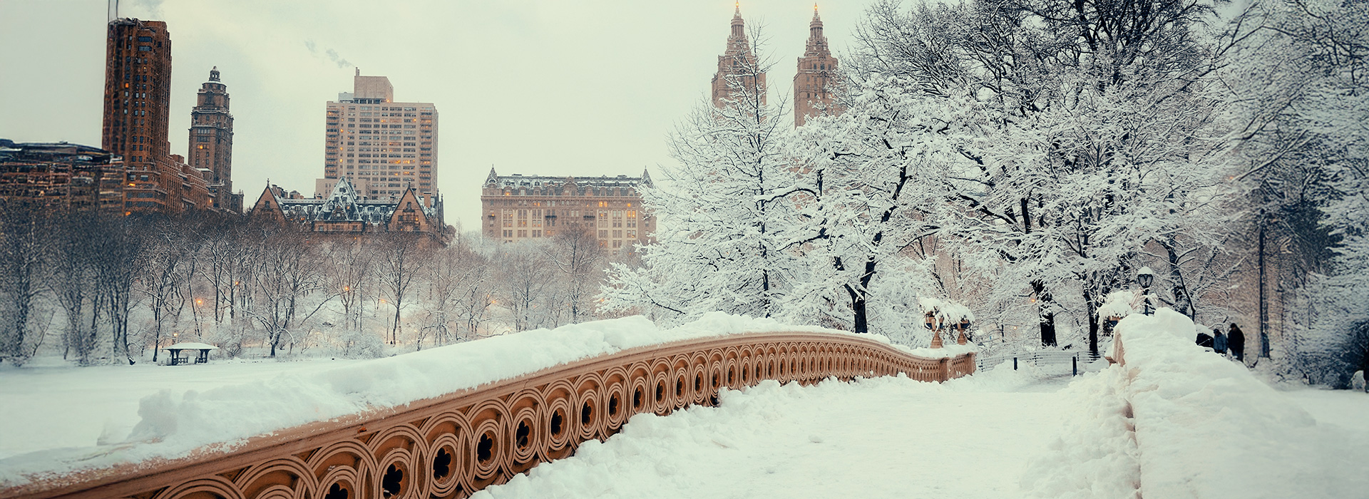 Central Park blanketed in snow, creating a winter wonderland in New York City — one of the best places to visit in December in the US.