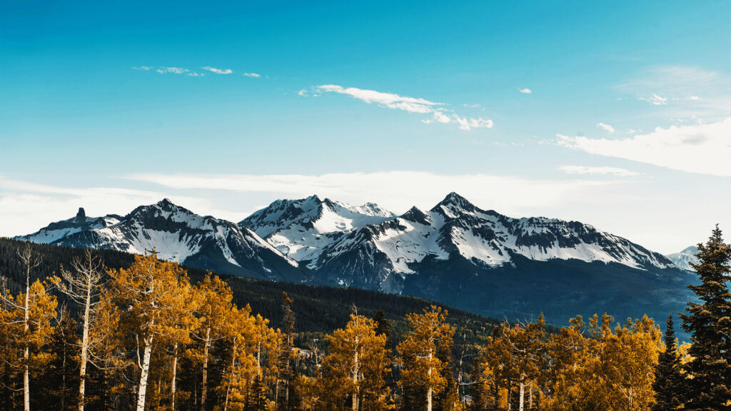 The rugged, snow-capped peaks of the Telluride Colorado mountains provide a stunning backdrop for outdoor adventures.