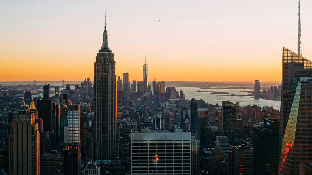 Empire State Building and Manhattan skyline at sunset