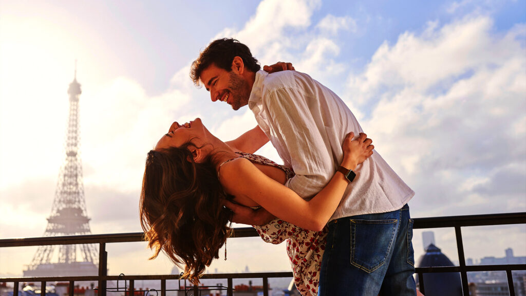 A couple sharing a romantic dance with the Eiffel Tower in the background, a perfect setting for a Valentine's Day getaway in Paris.