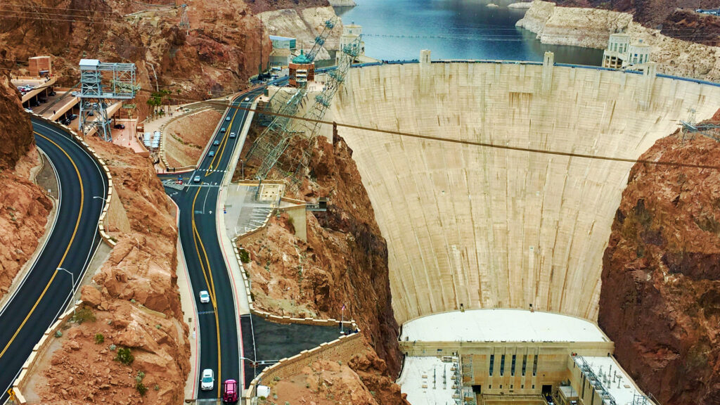 Hoover Dam with scenic views and winding roads.