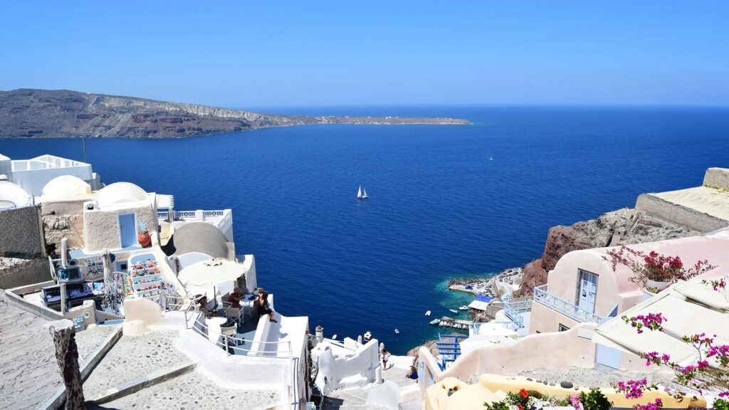 Best international beach destinations with breathtaking views of Santorini’s cliffside and the Aegean Sea