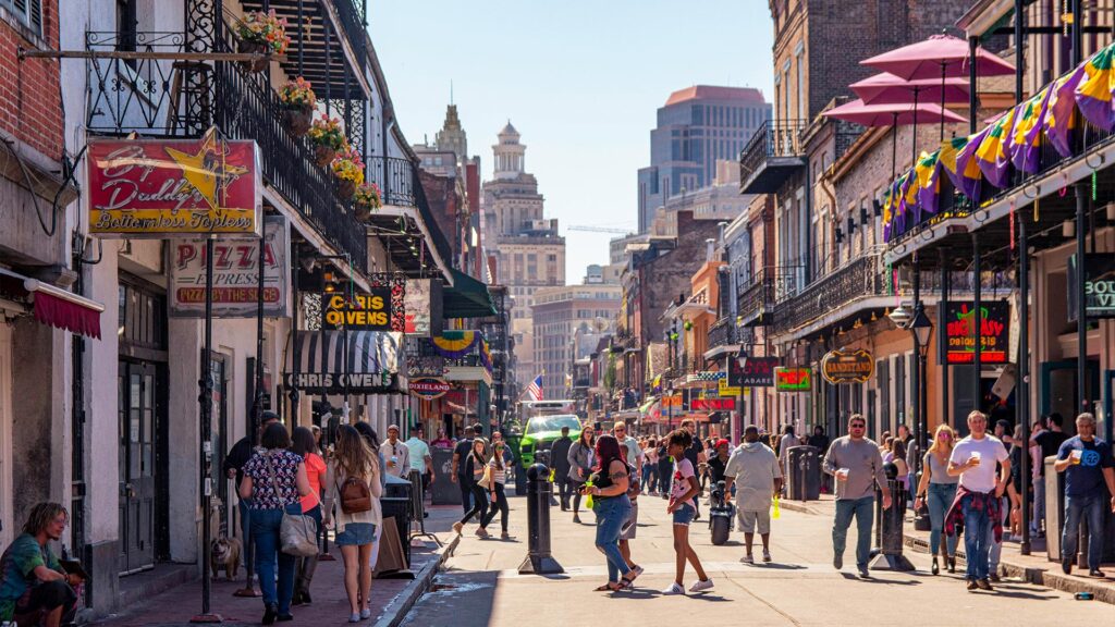 Spring Break Getaways showing a lively historic city street filled with tourists and culture
