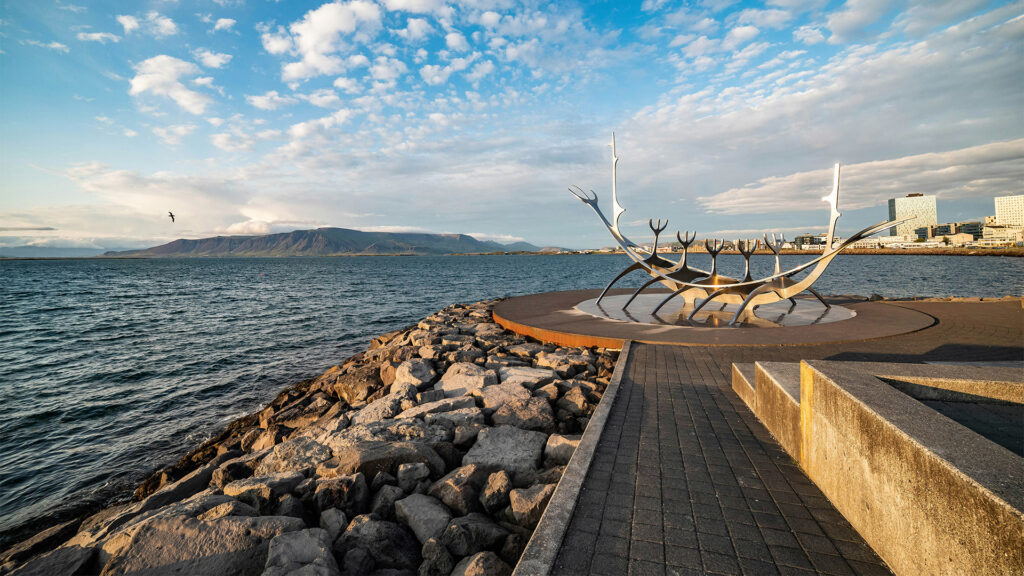 The stunning Sun Voyager sculpture by the sea in Reykjavik, Iceland—an ideal spot for solo travelers seeking peaceful summer getaways.