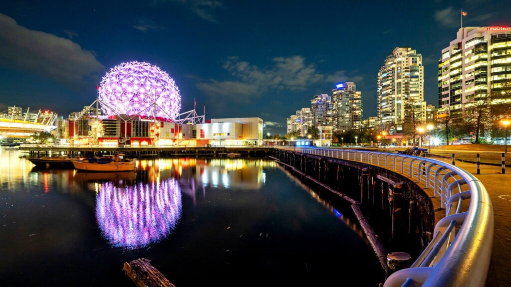 The vibrant Science World at night in Vancouver, Canada—an exciting destination for solo travelers on a summer adventure.